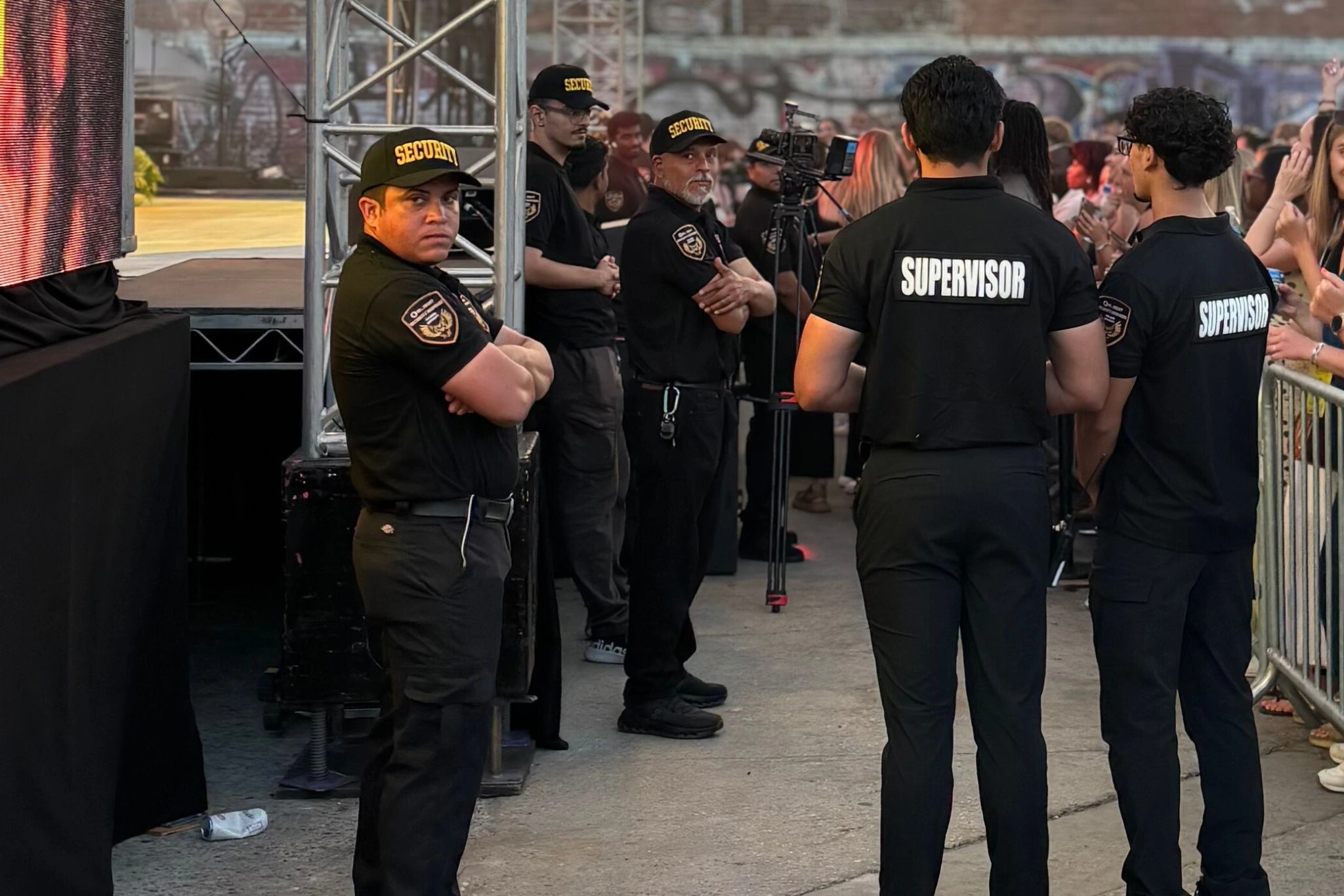 security guards for owl sight security services standing by the stage of a concert