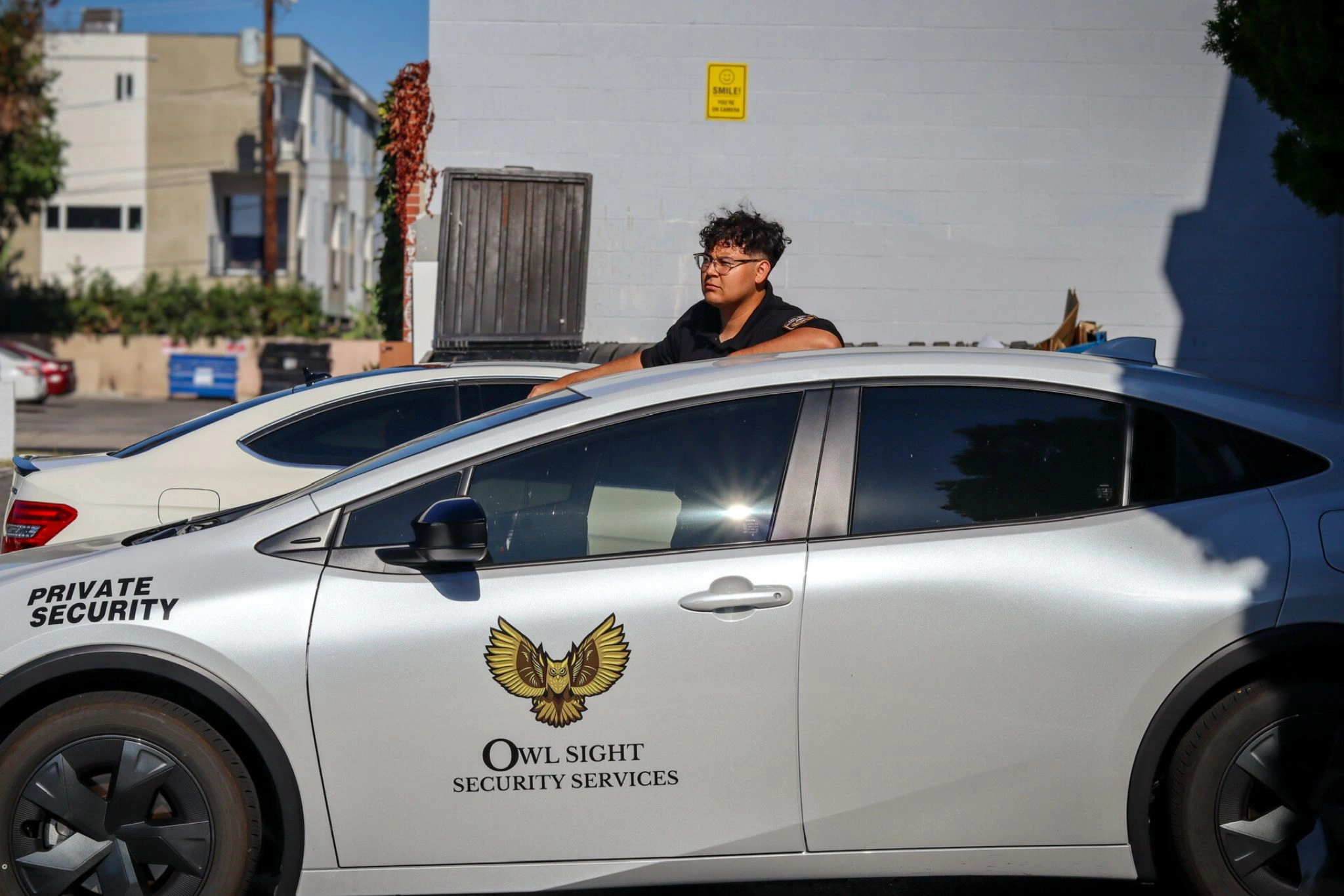 security guard outside of security patrol vehicle