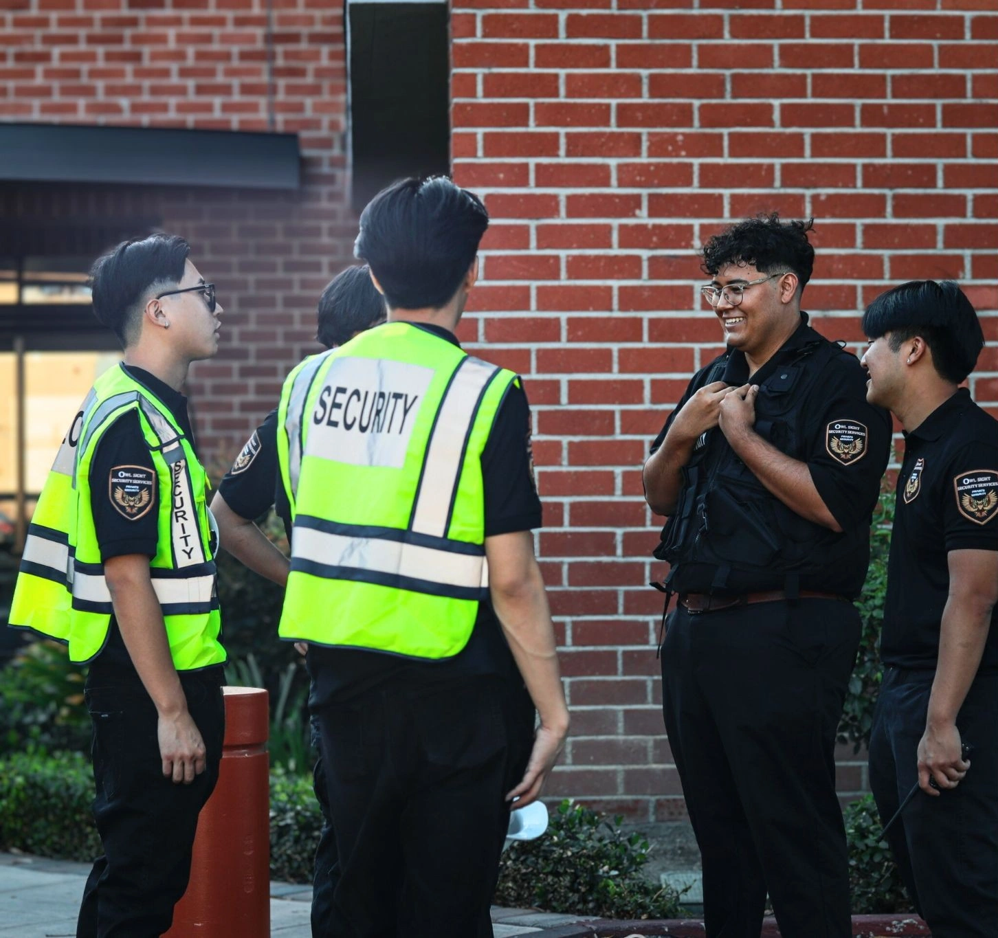 security guard meeting some guards wearing reflective vest other wearing security vest
