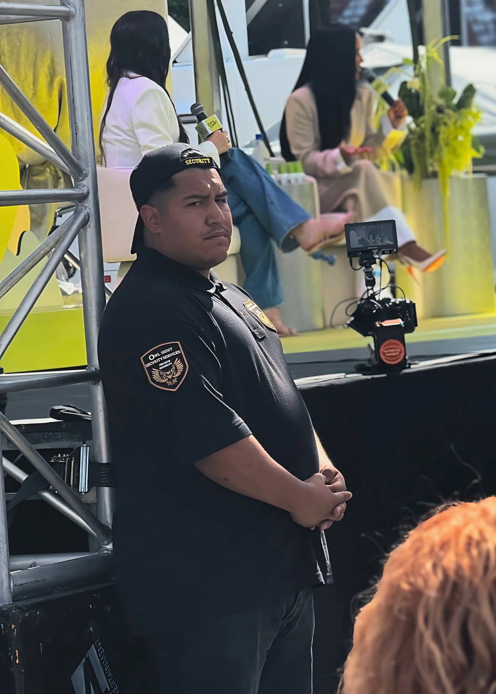 pop up event security guard in Los Angeles with the guard standing by stage