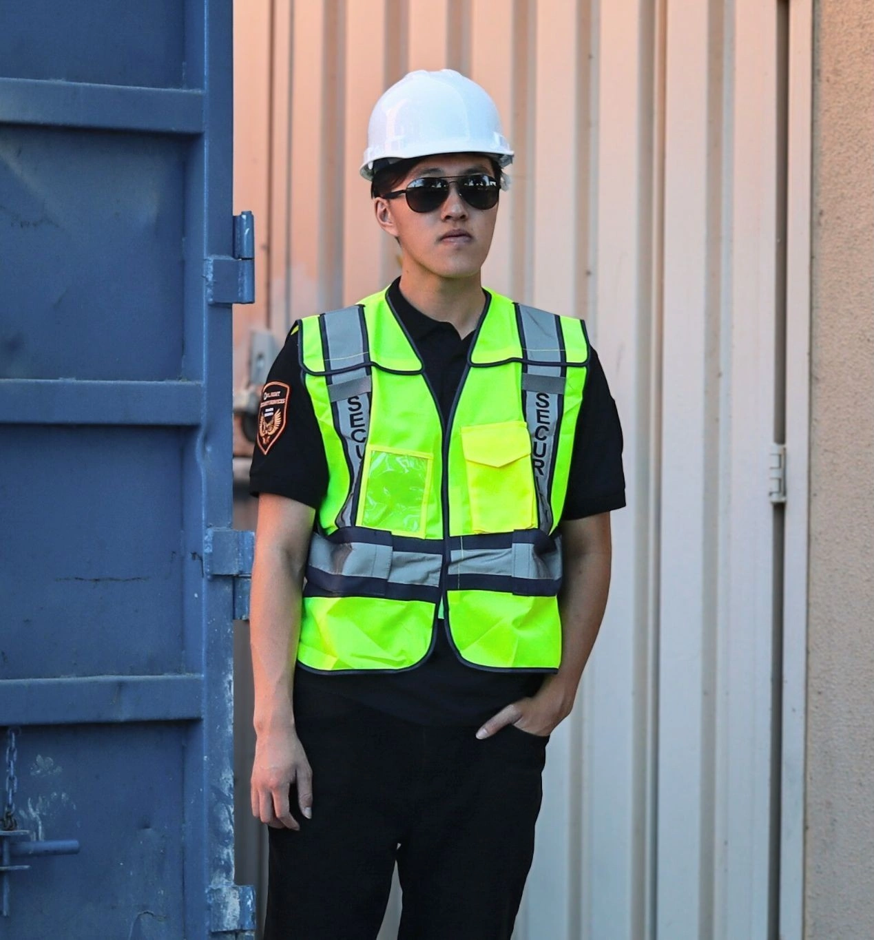 vacant property security guard in Los Angeles wearing reflective vest and construction helmet