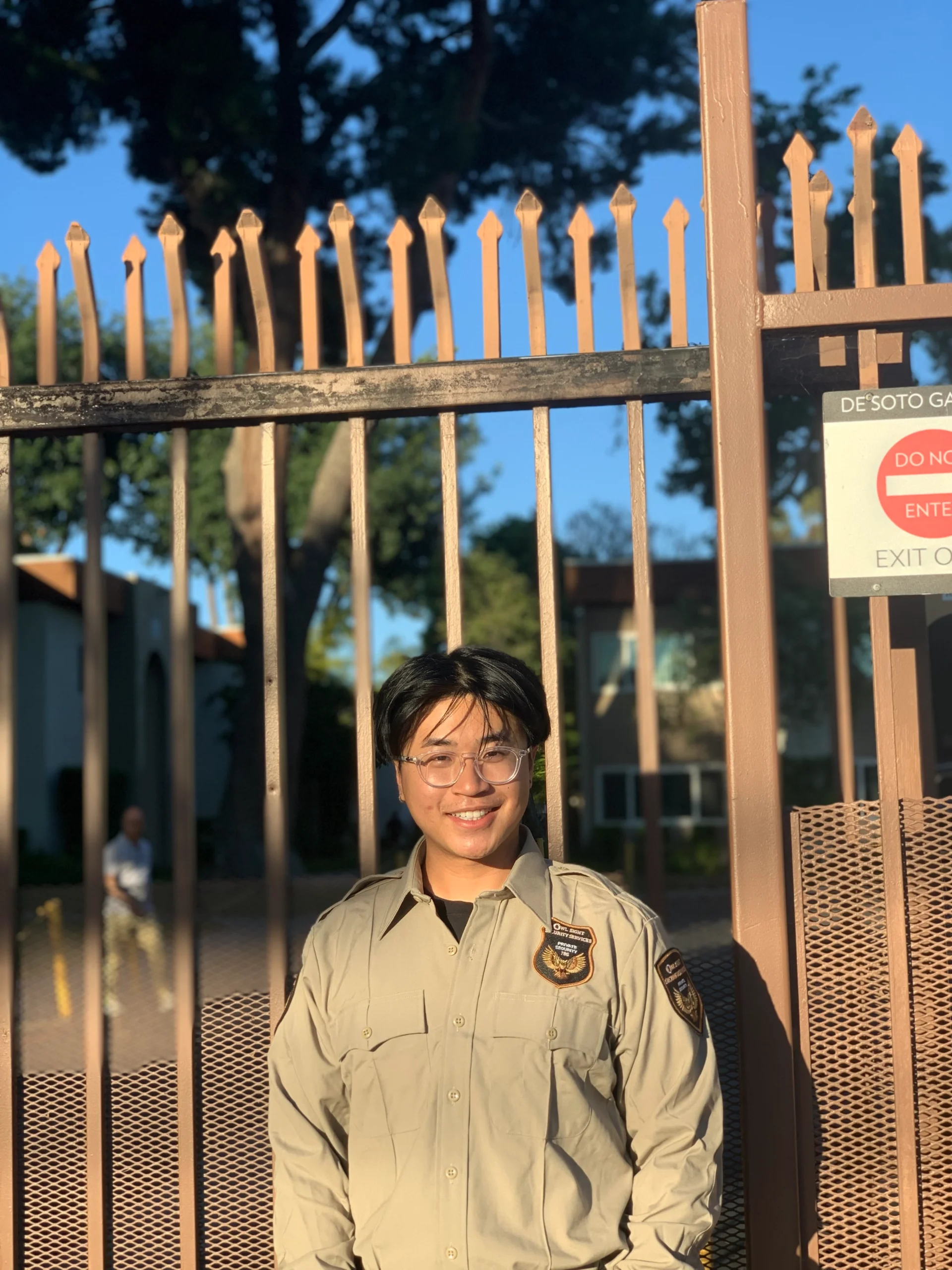 apartment security guard standing in front of apartment entrance