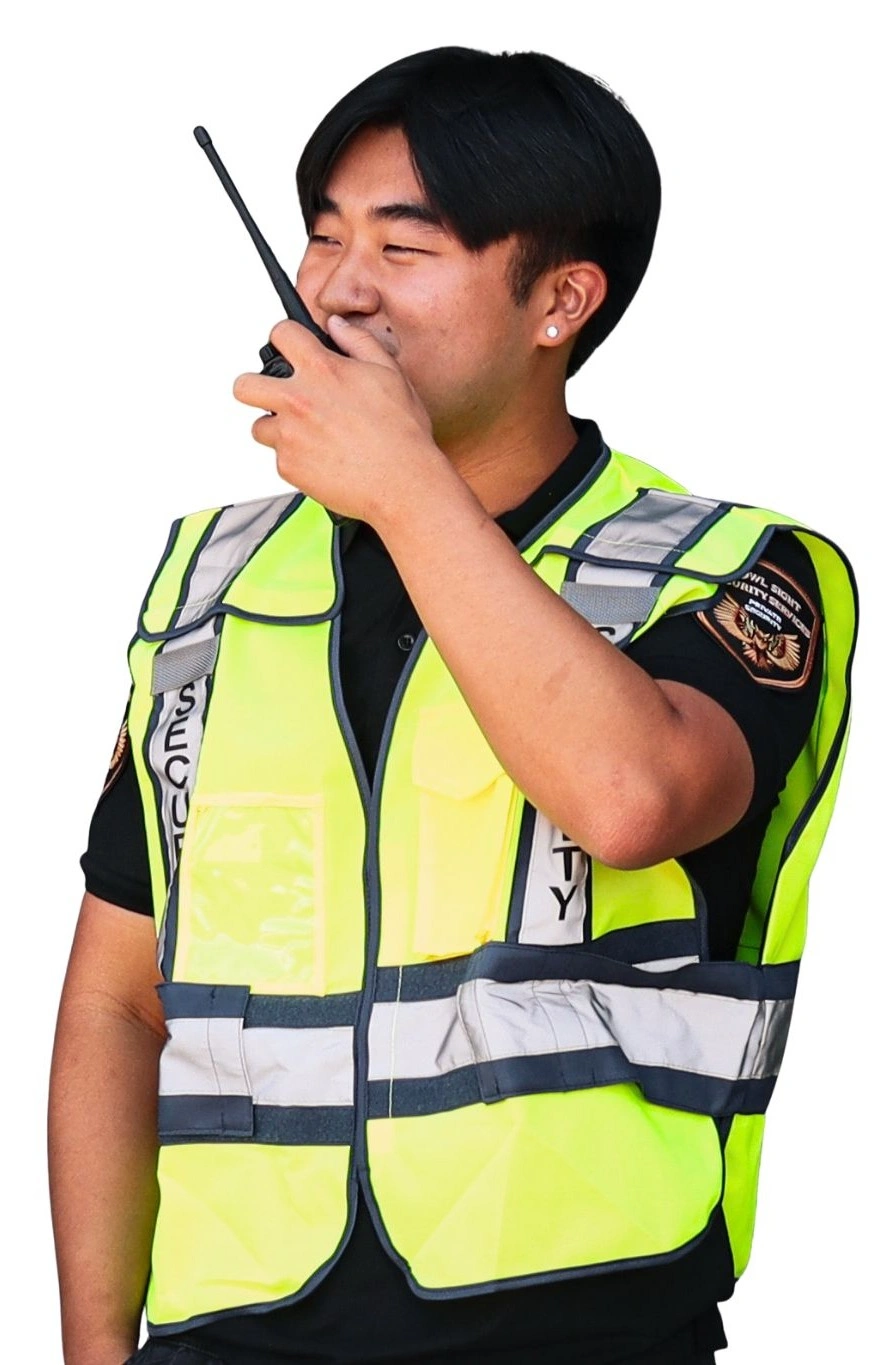 fumigation security guard in Beverly Hills wearing a reflective vest and talking on the radio