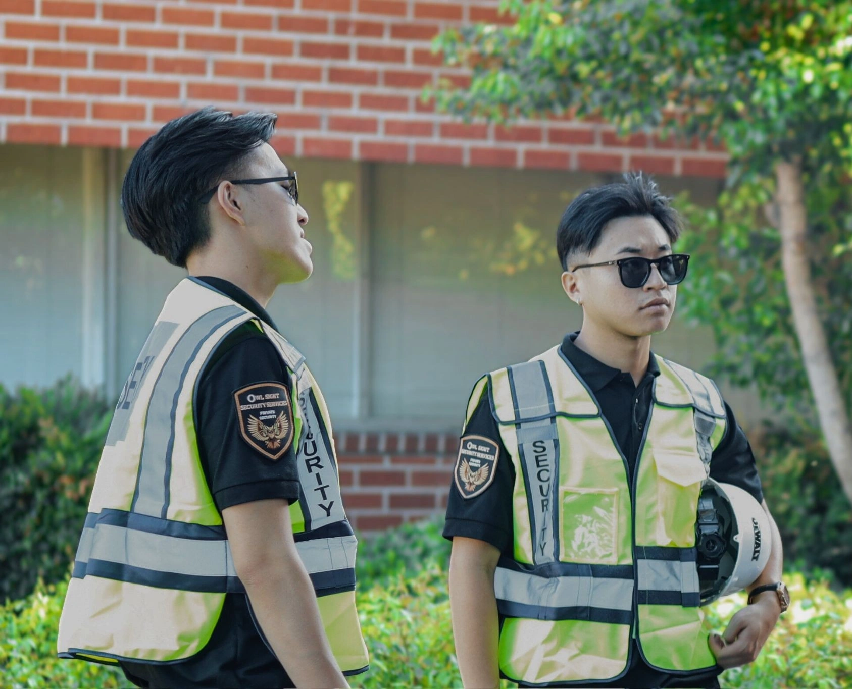 fumigation security guards in Long Beach wearing reflective vest and holding construction helmet