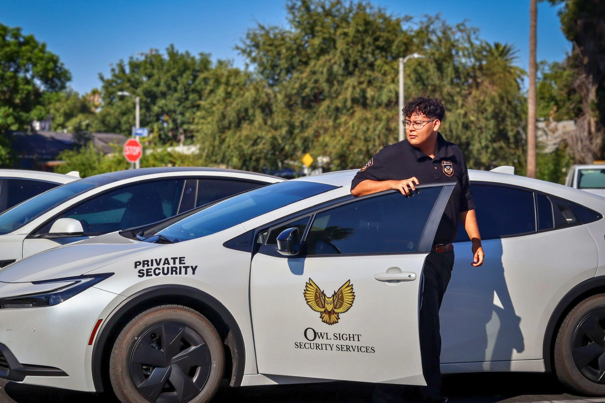 security guard arriving to the parking lot to enforce parking rules.