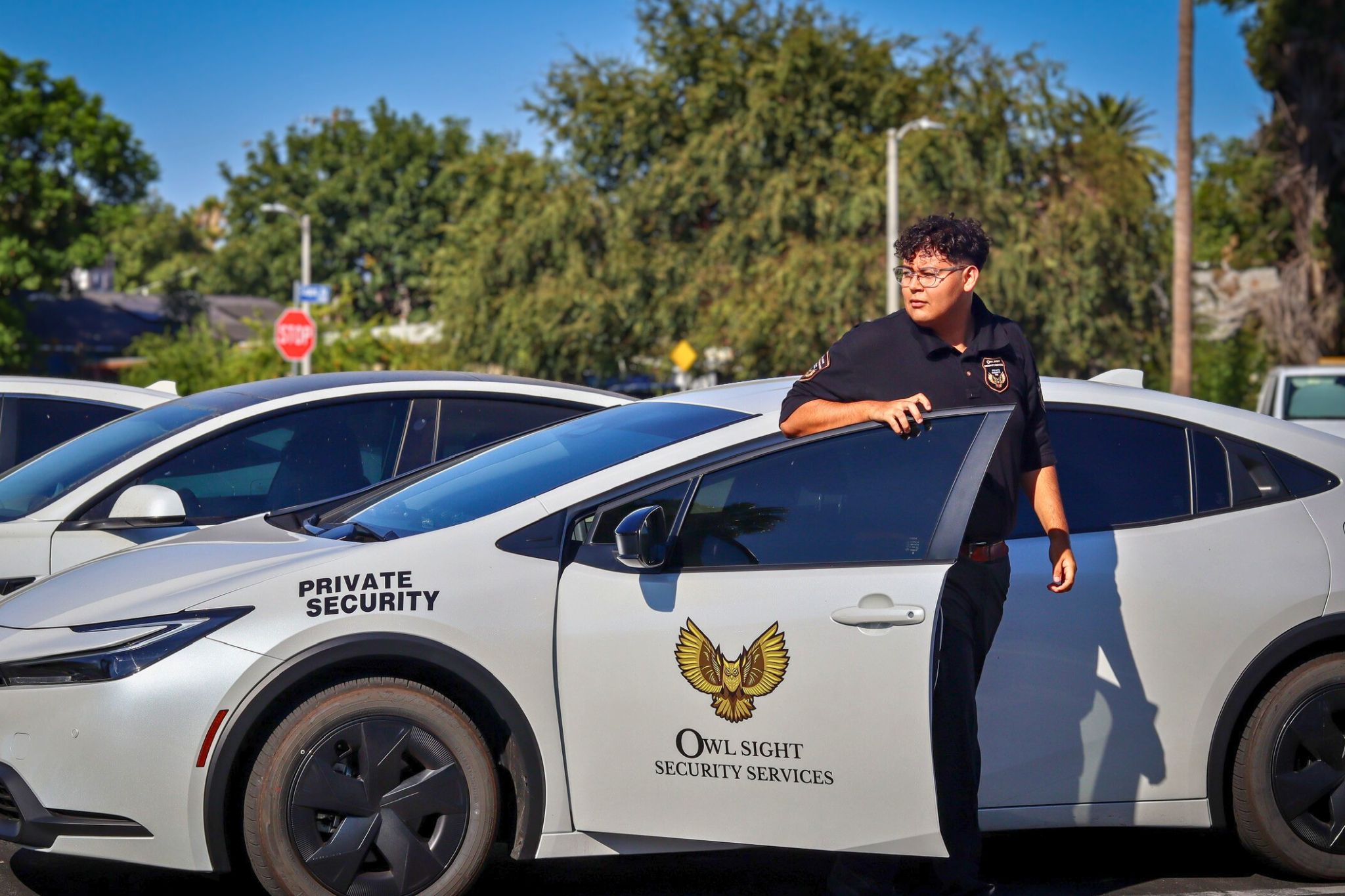 auto dealership security guard arrives to dealership lot
